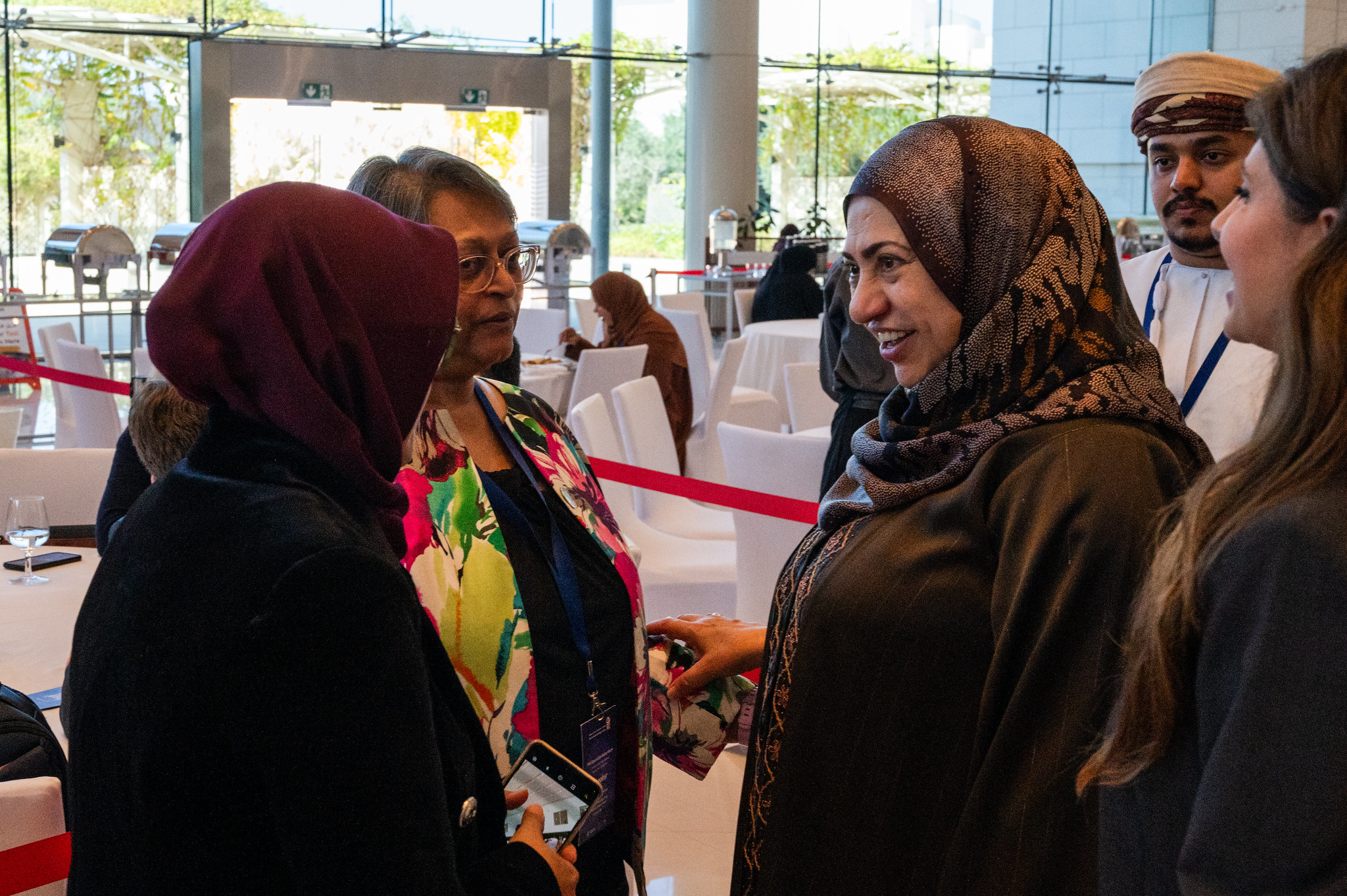 H.E. Rahma Ibrahim al Mahrouqi (right), Minister of Higher Education, Research and Innovation greeting TWAS President and TYAN members (Photo: G.Ortolani/TWAS).