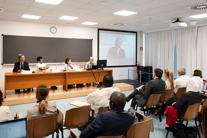 Seated (from left): Peter McGrath, TWAS Coordinator of the Science Policy/Science Diplomacy programme; Atish Dabholkar, TWAS Executive Director a.i. and ICTP Director; and Kimberly Montgomery, Director, International Affairs and Science Diplomacy American Association for the Advancement of Science (AAAS), US. On video: Giuseppe Pastorelli, Director for Integrated Promotion and Innovation at the Directorate General for Country Promotion, Ministry of Foreign Affairs and International Cooperation of Italy.  (P